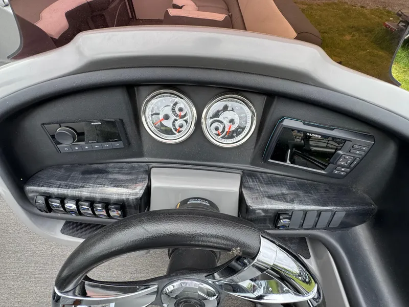 Slide: The Image of Dashboard of 2021 Avalon Catalina Rear J Lounger 25' with gauges and Garmin display. - 40