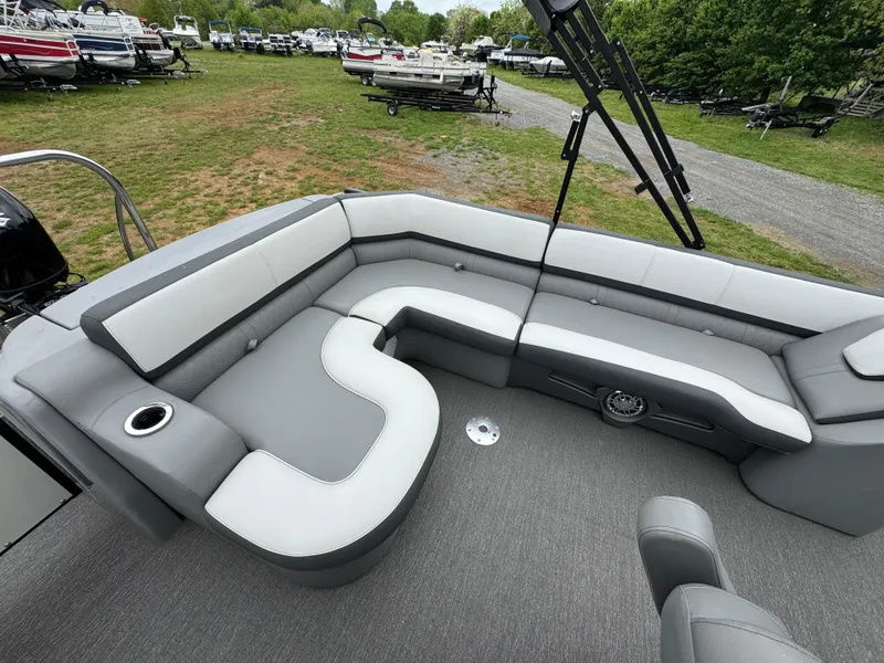 Slide: The Image of 2021 Avalon Catalina Rear J Lounger 25' boat interior with gray seating and cup holder. - 41