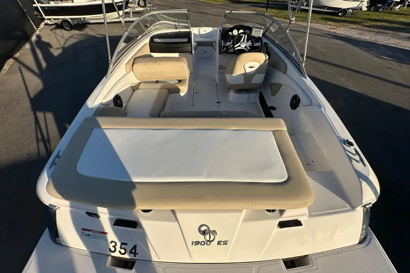 Slide: The Image of 2017 Regal 1900 Bowrider boat interior with beige seating and steering console. - 16