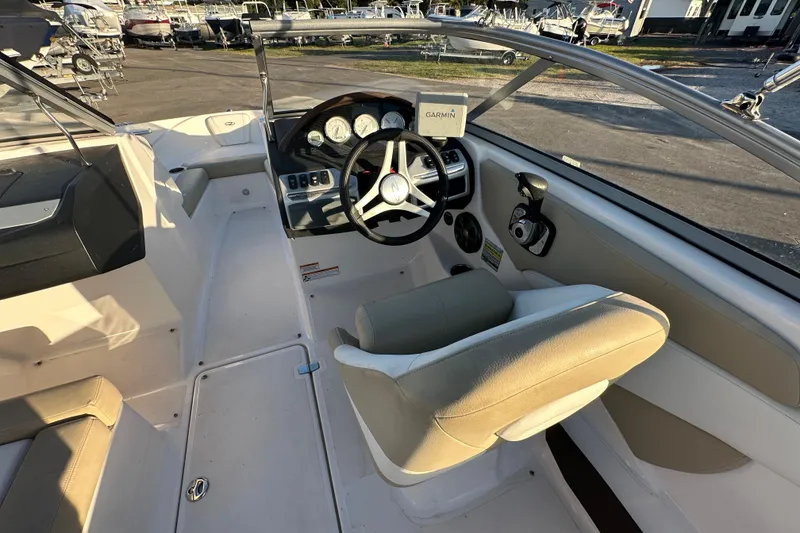 Slide: The Image of 2017 Regal 1900 Bowrider interior with steering wheel and Garmin navigation system. - 26
