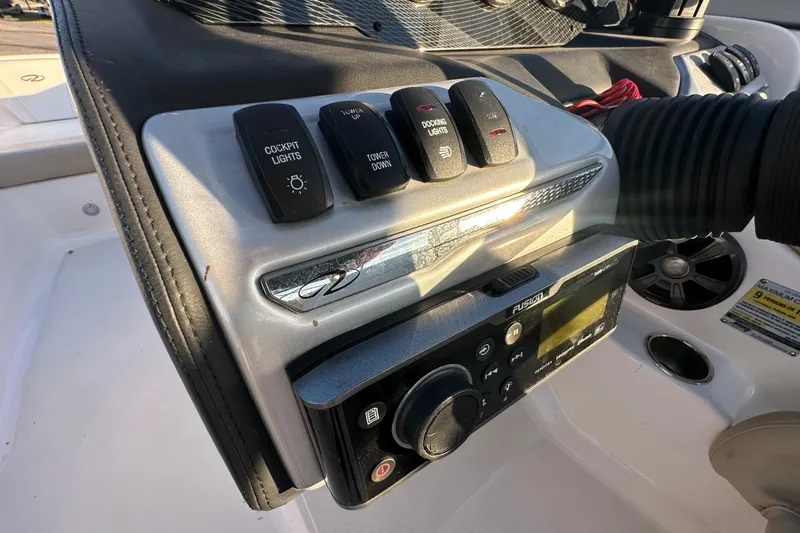 Slide: The Image of Control panel of 2017 Regal 1900 Bowrider boat with switches and audio system. - 27