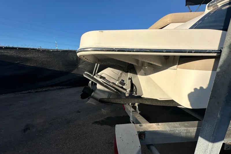 Slide: The Image of 2017 Regal 1900 Bowrider boat on trailer, rear view under clear blue sky. - 3