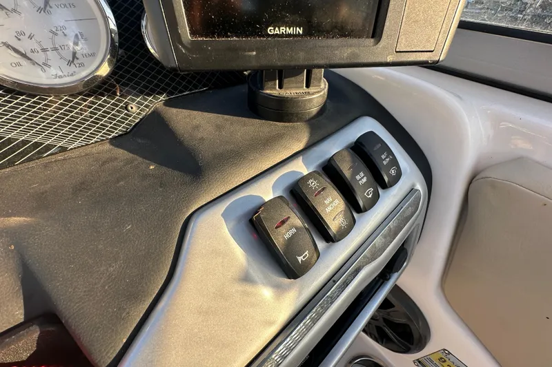 Slide: The Image of Dashboard controls of a 2017 Regal 1900 Bowrider with Garmin display and switches. - 32