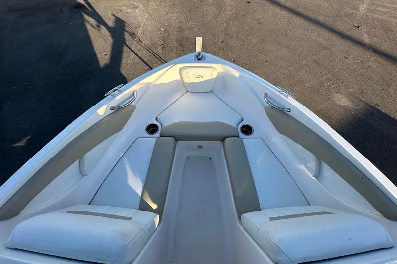 Slide: The Image of 2017 Regal 1900 Bowrider boat interior with cushioned seating and cup holders. - 38