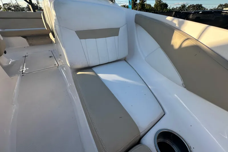 Slide: The Image of 2017 Regal 1900 Bowrider interior with beige and white seating, cup holder, and sleek design. - 47