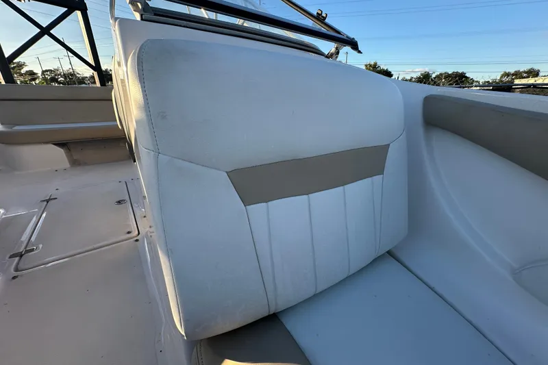 Slide: The Image of 2017 Regal 1900 Bowrider interior seating with white and beige upholstery. - 48