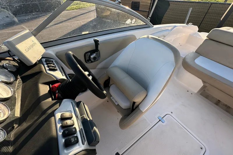 Slide: The Image of 2017 Regal 1900 Bowrider interior with steering wheel, Garmin device, and seating. - 55