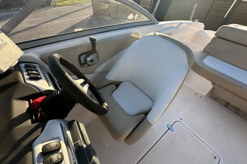 Slide: The Image of 2017 Regal 1900 Bowrider interior with steering wheel and seating area. - 56