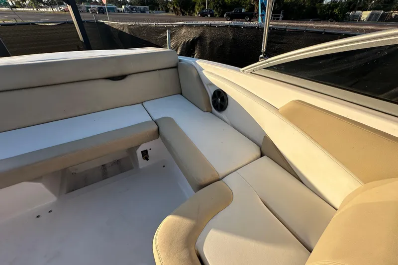 Slide: The Image of 2017 Regal 1900 Bowrider interior seating with beige upholstery and speaker. - 59