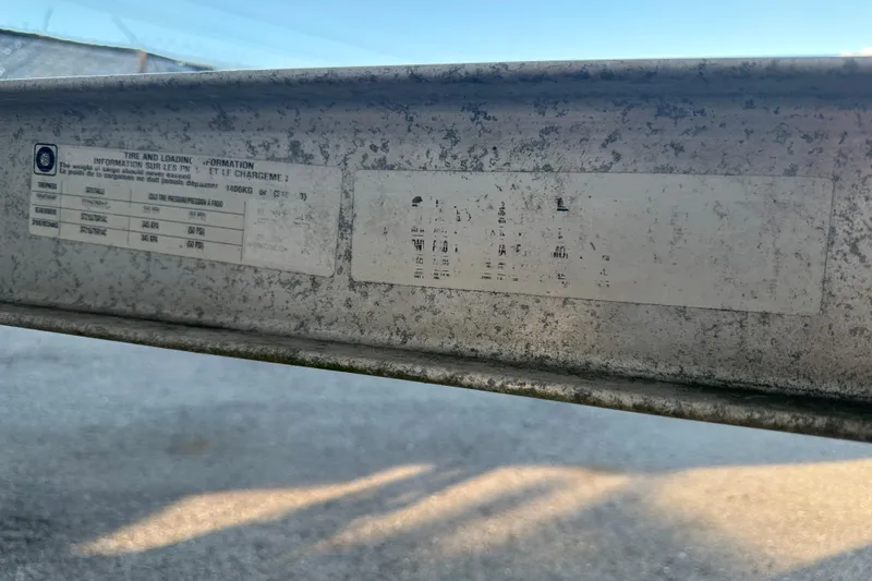 Slide: The Image of Close-up of a 2017 Regal 1900 Bowrider's tire and loading information label. - 71