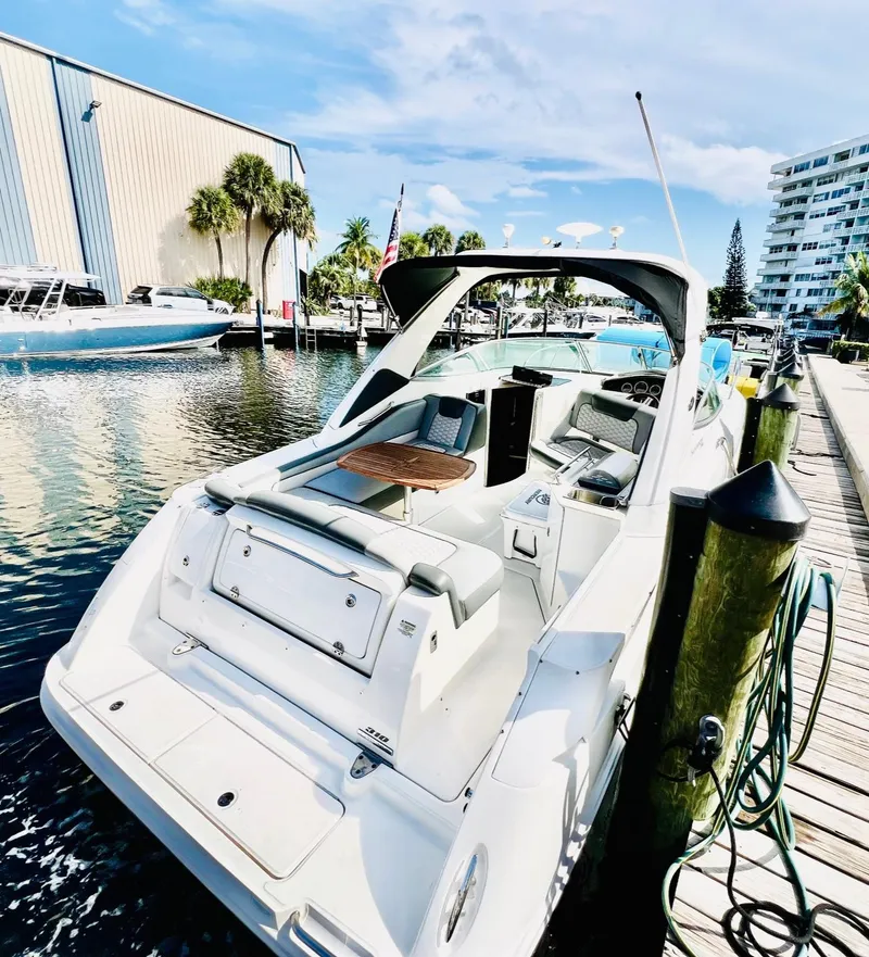 Slide: The Image of Twin engines in a 2010 Sea Ray 310 Sundancer boat, with visible wiring and fire extinguisher. - 10