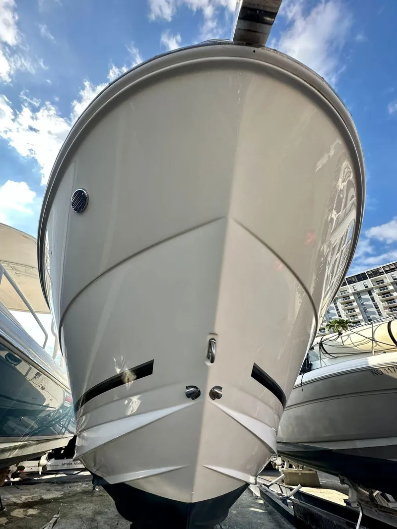 Slide: The Image of Interior view of 2010 Sea Ray 310 Sundancer boat with ocean backdrop. - 9