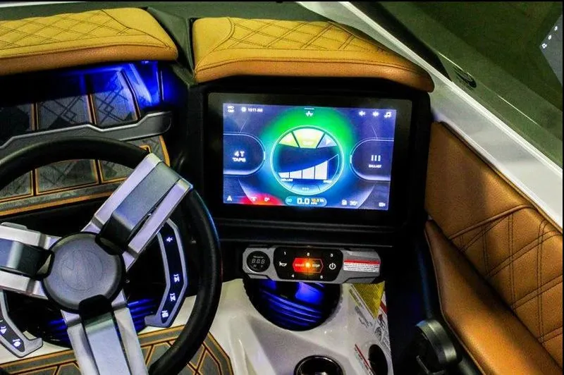 Slide: The Image of 2025 Tigé 22RZX dashboard with touchscreen display and modern steering wheel. - 14