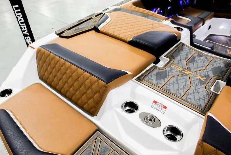 Slide: The Image of 2025 Tigé 22RZX boat interior with luxurious tan and black seating, stylish design accents. - 23