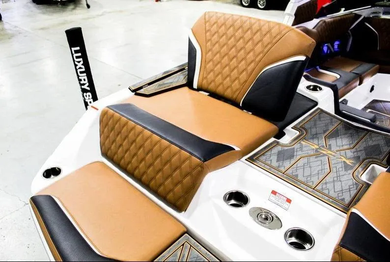 Slide: The Image of 2025 Tigé 22RZX boat interior with luxury seating and stylish design. - 25