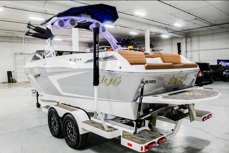 Slide: The Image of 2025 Tigé 22RZX boat in a garage, featuring sleek design and modern amenities. - 3