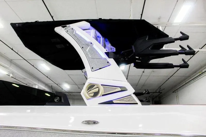 Slide: The Image of 2025 Tigé 22RZX boat tower with sleek design and modern features in a showroom. - 30