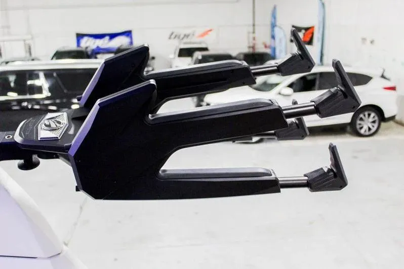 Slide: The Image of 2025 Tigé 22RZX boat accessory in a showroom with cars in the background. - 32