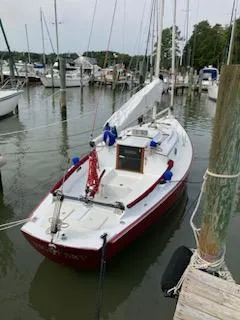 Slide: The Image of 2000 Great Harbour 26 ft sailboat docked in a marina, surrounded by other boats. - 14