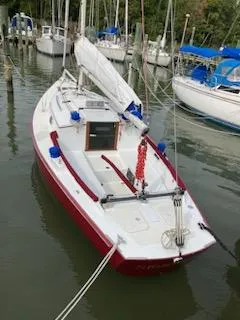 Slide: The Image of Red and white 2000 Great Harbour 26 ft. sailboat docked in a marina. - 15