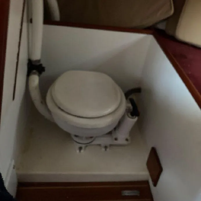 Slide: The Image of Boat toilet in a 2000 Great Harbour 26 ft. model, compact marine design. - 6
