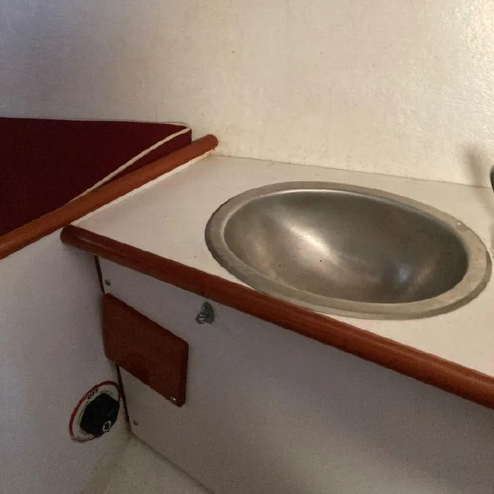 Slide: The Image of Compact sink area in a 2000 Great Harbour 26 ft. boat interior. - 7
