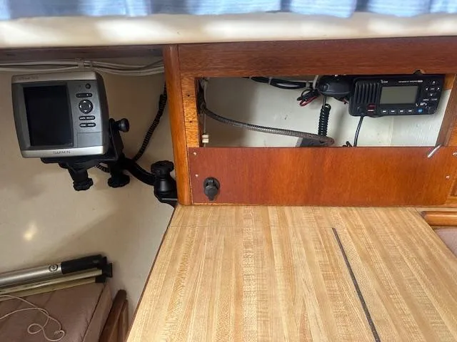 Slide: The Image of 1979 Bristol 299 boat interior with navigation equipment and wooden cabinetry. - 12