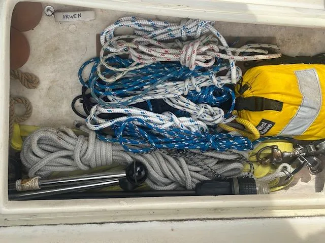 Slide: The Image of Assorted ropes and gear in a Bristol 299 sailboat storage compartment, 1979 model. - 15