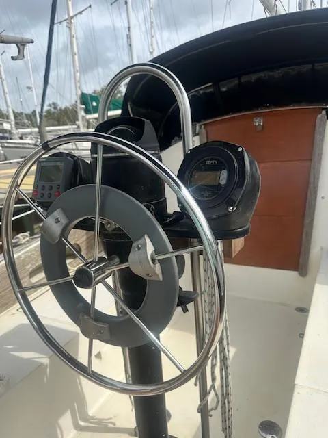 Slide: The Image of 1979 Bristol 299 sailboat cockpit with steering wheel and navigation instruments. - 3
