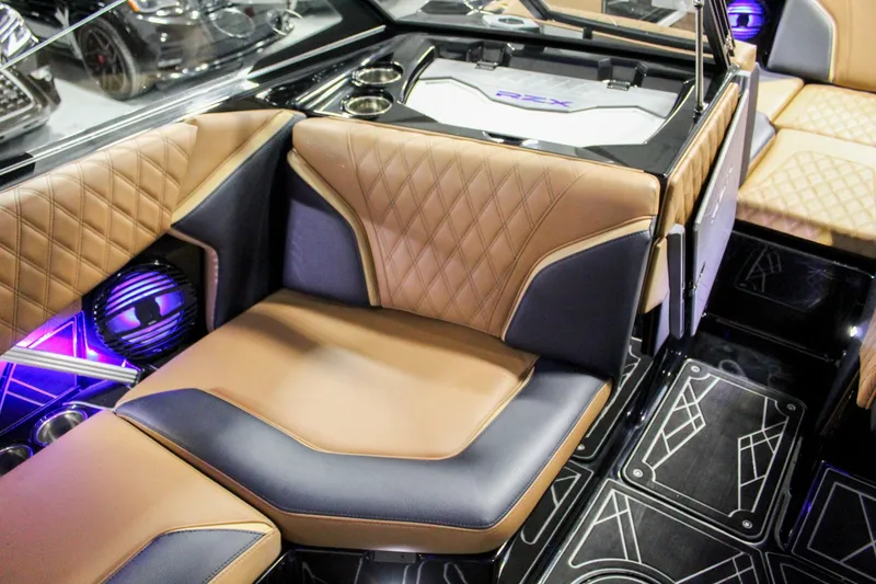 Slide: The Image of Luxurious interior of 2025 Tigé 22RZX boat with diamond-stitched seating and modern design. - 17