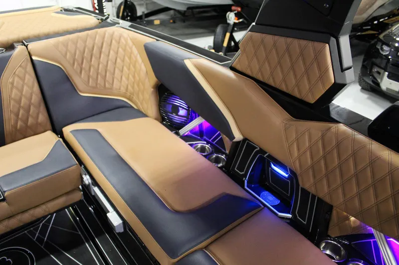 Slide: The Image of Luxurious interior of 2025 Tigé 22RZX boat with quilted seats and ambient lighting. - 18