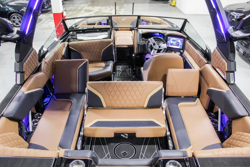 Slide: The Image of 2025 Tigé 22RZX boat interior with luxurious seating and modern dashboard. - 21
