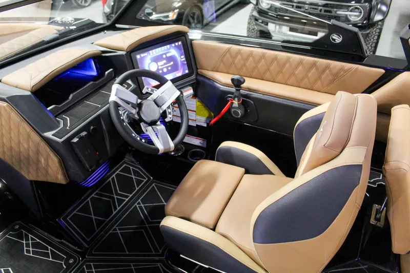Slide: The Image of 2025 Tigé 22RZX boat interior with modern dashboard and luxurious seating. - 9