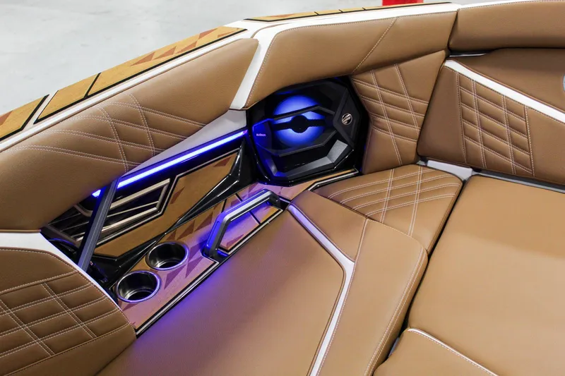 Slide: The Image of Luxurious interior of 2025 Tigé Ultré 25ZX boat with brown leather seating and LED lighting. - 12