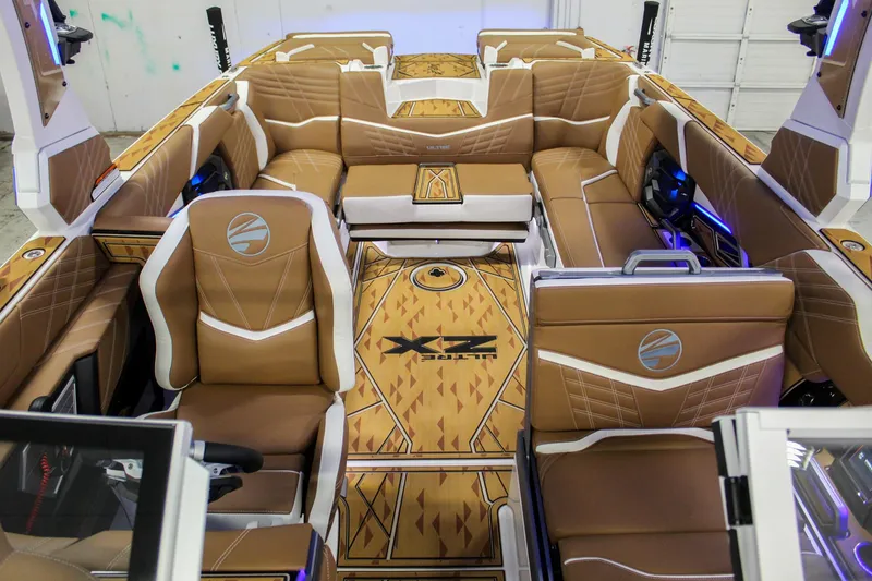 Slide: The Image of 2025 Tigé Ultré 25ZX boat interior with luxurious tan seating and modern design. - 16