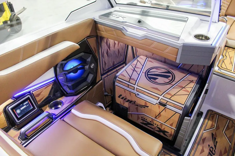 Slide: The Image of Interior of 2025 Tigé Ultré 25ZX boat with luxurious seating and modern dashboard. - 22