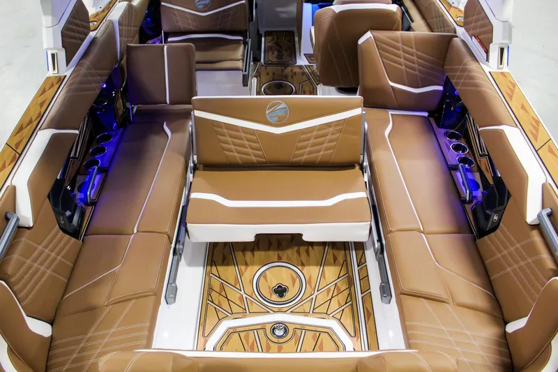 Slide: The Image of Luxurious interior of 2025 Tigé Ultré 25ZX boat with brown leather seating. - 29