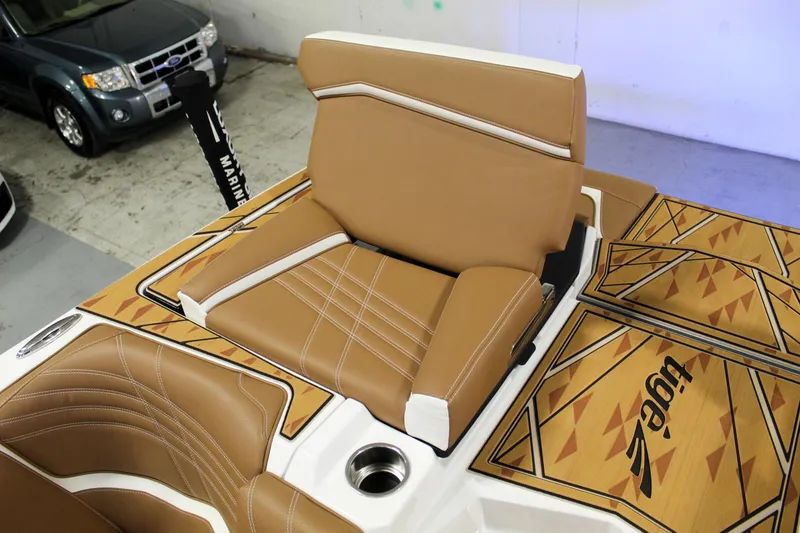 Slide: The Image of 2025 Tigé Ultré 25ZX boat interior with tan leather seating and stylish design. - 32