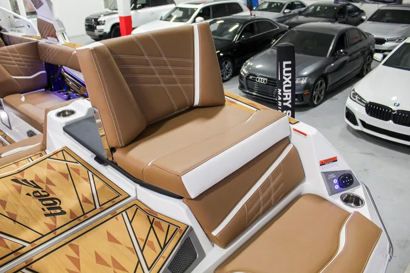 Slide: The Image of 2025 Tigé Ultré 25ZX boat interior with luxury seating and modern design. - 35