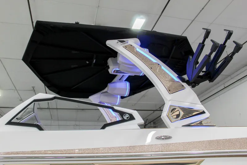Slide: The Image of 2025 Tigé Ultré 25ZX boat with sleek design and modern features in a showroom. - 36