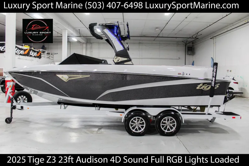 Slide: The Image of 2025 Tigé Z3 boat in showroom, 23ft, Audison 4D sound, full RGB lights, on trailer. - 0