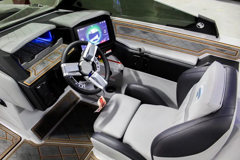 Slide: The Image of Interior of 2025 Tigé Z3 boat with modern dashboard and luxurious seating. - 10