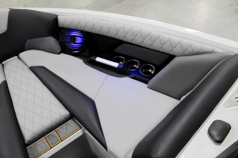 Slide: The Image of Luxurious interior of 2025 Tigé Z3 boat with quilted seats and cup holders. - 12