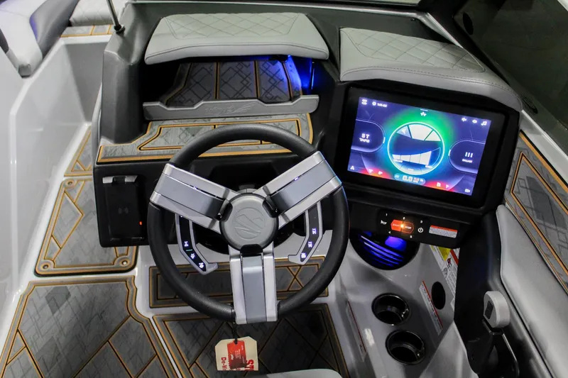 Slide: The Image of 2025 Tigé Z3 boat dashboard with modern steering wheel and digital display. - 14