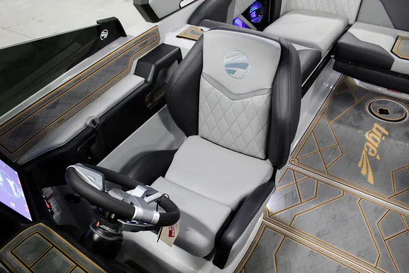 Slide: The Image of 2025 Tigé Z3 boat interior with luxurious seating and modern steering wheel design. - 17