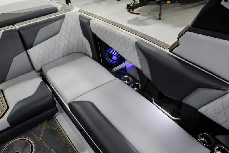 Slide: The Image of 2025 Tigé Z3 boat interior with luxurious seating and ambient lighting. - 19