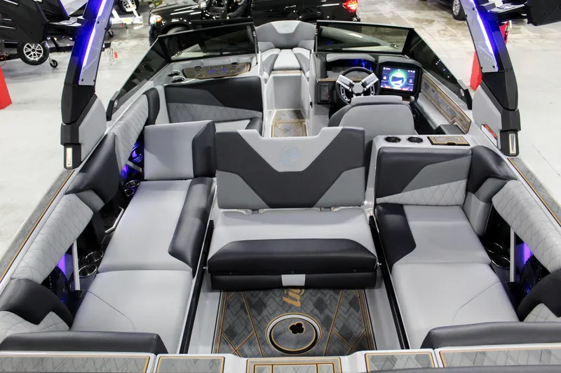 Slide: The Image of 2025 Tigé Z3 boat interior with modern seating and advanced dashboard technology. - 22