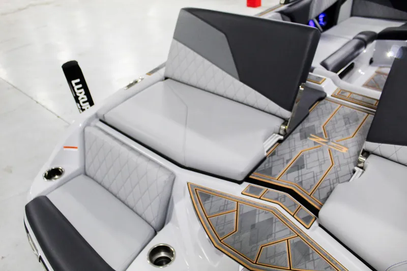 Slide: The Image of 2025 Tigé Z3 boat interior with luxurious seating and stylish geometric flooring design. - 26