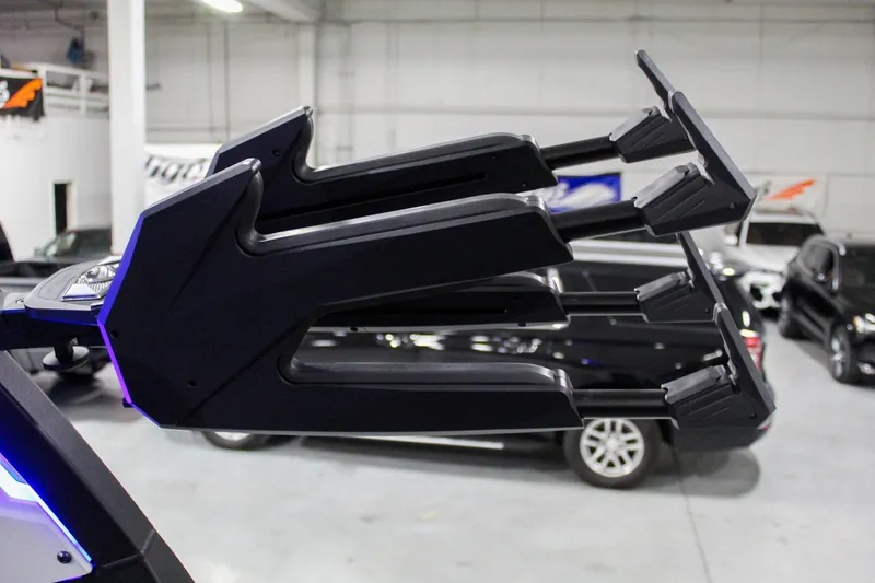 Slide: The Image of 2025 Tigé Z3 boat tower in a showroom with cars in the background. - 30