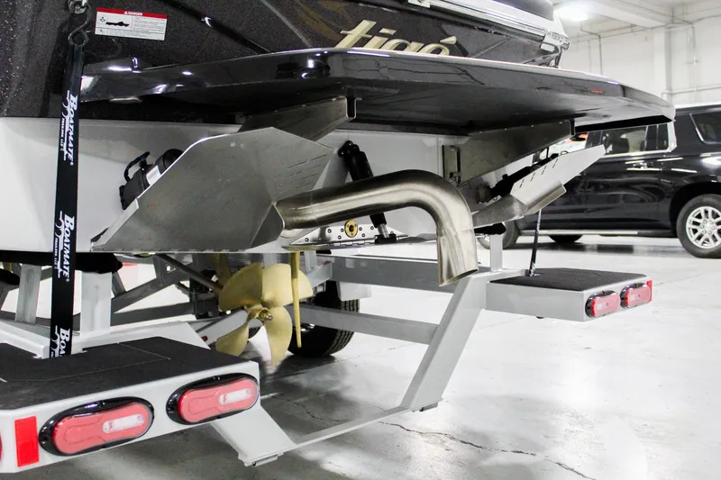 Slide: The Image of 2025 Tigé Z3 boat trailer with propeller and exhaust system in a garage setting. - 34